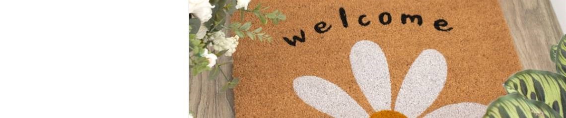 Wholesale doormats in a variety of unique styles. Includes festive designs and welcoming phrases to complement any home entrance. Perfect for homeware and gift retailers. No minimum order and worldwide shipping.