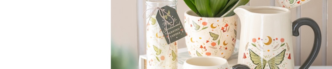 Fairy Folklore wholesale gift range featuring mushroom-shaped mugs, oil burners, butterfly decor, enchanted jewellery, and home accessories with whimsical woodland designs. Includes earthy-toned candles, planters, tote bags, and ceramic ornaments inspired by folklore and nature. Perfect for garden centres, gift shops, and retailers seeking magical and nature-inspired products.