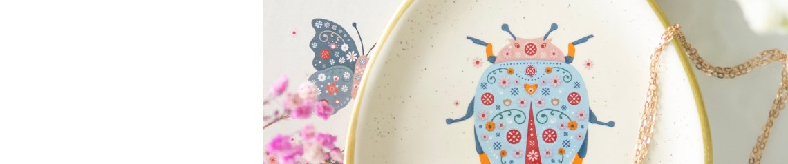 Floral Bug wholesale homeware and gift range featuring colourful butterfly and ladybird designs on mugs, doormats, planters, wall art, candles, and garden accessories. A playful and pretty collection perfect for spring-summer gifting, ideal for florists, gift shops, and garden centres seeking nature-inspired, whimsical stock.