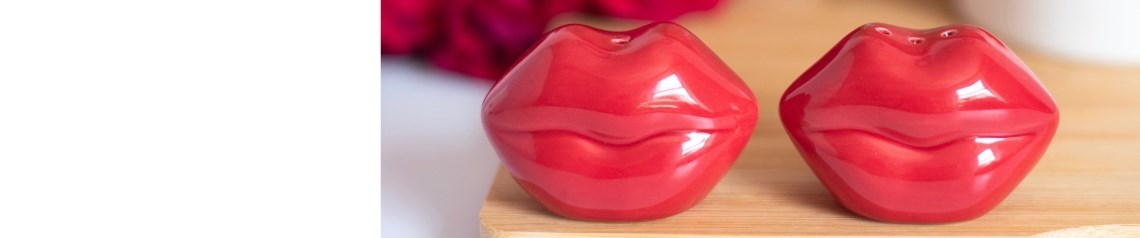Kiss Kiss Valentine's Day collection featuring wholesale mugs, candles, stationery, trinket dishes and keepsakes with red lips, hearts, love letters, pink accents and blue stripes.