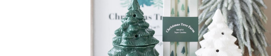 Winter Wonderland wholesale Christmas collection featuring festive home decor and gifts with alpine charm, including tree-shaped oil burners, cosy cabins, pine-scented candles, mugs with fluffy socks, seasonal signage, and balsam fir incense. Ideal for gift shops, garden centres, and holiday retailers seeking rustic winter-themed stock.