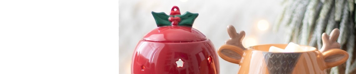Festive oil burners, wax warmers and tealight holders in gonk and bauble designs. Cosy, cheerful products for holiday displays. No minimum order.