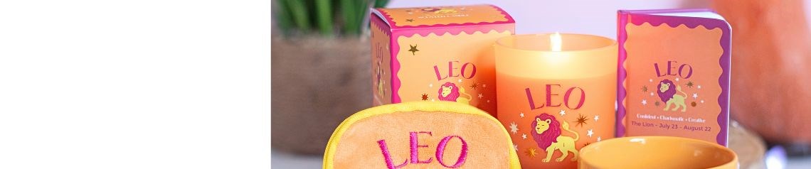 Colourful Zodiac Zest collection featuring wholesale zodiac candles, mugs, notebooks, bookmarks, keyrings and accessories with playful celestial motifs in pink, blue, green, orange and purple.