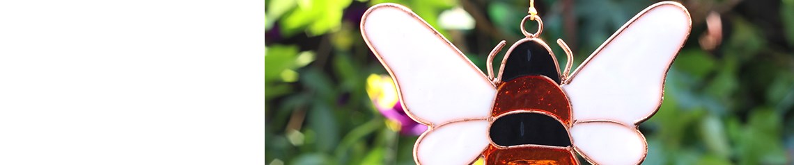 Wholesale bee-themed gifts including suncatchers, home decor and windchimes in exclusive designs. Perfect for nature-inspired retail displays.