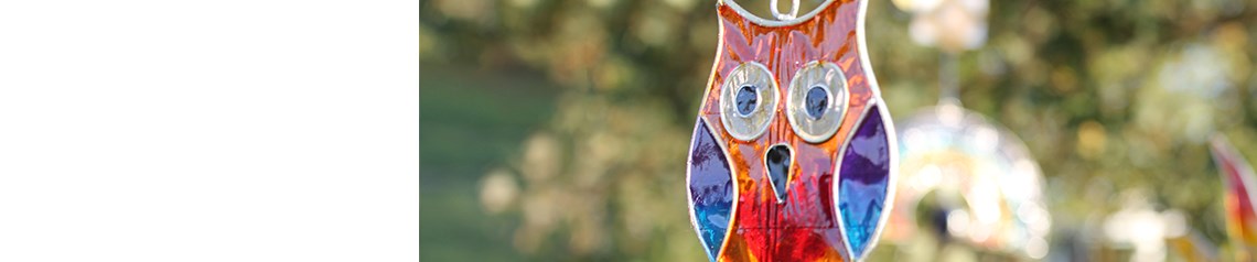 Wholesale owl-themed gifts and home accessories. Includes licensed art designs and bestselling windchimes.