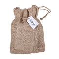 Plaque avec devise « Precious Little Miracle » dans un sac en toile de jute