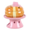 Oljelampa och vaxvärmare i form av ett hot cross bun