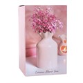 Vaso da fiori rosa a coste