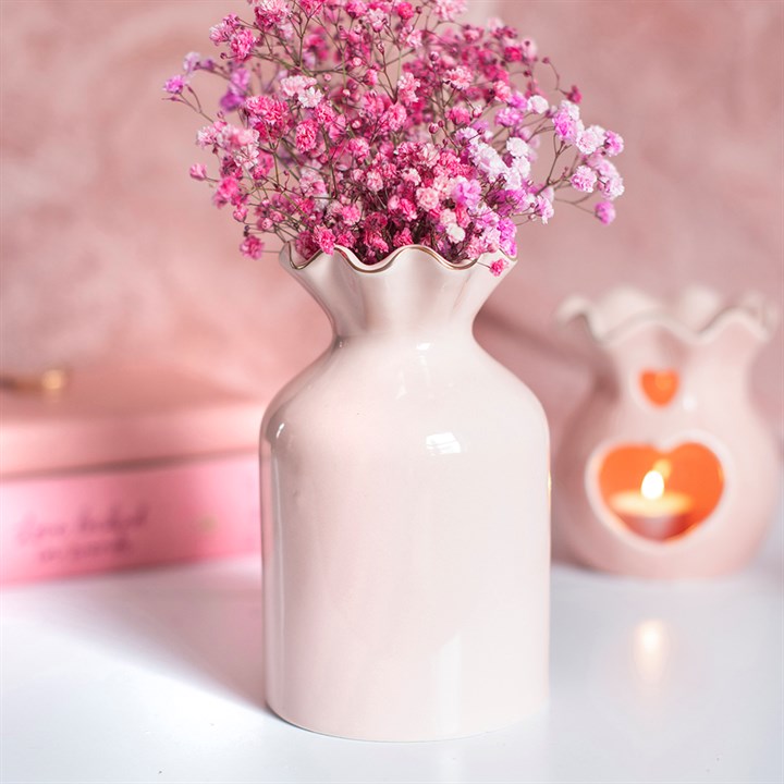 Vaso da fiori rosa a coste