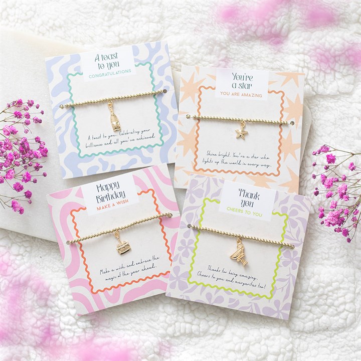 24 kappaleen juhlarannekesarja esittelytelineessä